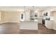 Modern kitchen with stainless steel appliances, granite countertops, a kitchen island, and a breakfast bar at 122 Wilderness Trl, Smithfield, NC 27577