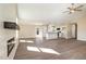 Bright living room with an open-concept layout, modern fireplace, and wood flooring at 122 Wilderness Trl, Smithfield, NC 27577