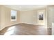 Bright, airy room featuring luxury vinyl floors, a large window, and easy access to the outdoors at 122 Wilderness Trl, Smithfield, NC 27577
