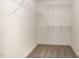 The walk-in closet offers plenty of storage space with multiple levels of wire shelving at 122 Wilderness Trl, Smithfield, NC 27577