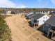 Aerial view of newly constructed homes showcasing landscaping and community layout at 1241 White Flint Cir, Durham, NC 27703