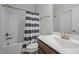Clean bathroom featuring a single sink vanity, toilet, bathtub, shower with curtain, and neutral walls at 1241 White Flint Cir, Durham, NC 27703