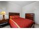 Comfortable bedroom featuring neutral walls, a dark wood dresser, and a large bed with decorative pillows at 1241 White Flint Cir, Durham, NC 27703