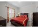 Inviting bedroom featuring warm natural lighting, neutral walls, a dark wood dresser, and crown moulding at 1241 White Flint Cir, Durham, NC 27703