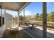 Covered wooden deck with seating and scenic views of the surrounding nature at 1241 White Flint Cir, Durham, NC 27703