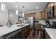 Well-equipped kitchen with stainless appliances, modern cabinets, tile backsplash, and an island with sink at 1241 White Flint Cir, Durham, NC 27703