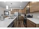 Bright kitchen with stainless appliances, modern cabinets, a tile backsplash, and a large kitchen island at 1241 White Flint Cir, Durham, NC 27703