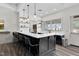 Stylish kitchen bar with white countertops, pendant lighting, and modern seating at 1241 White Flint Cir, Durham, NC 27703