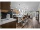 Spacious kitchen with stainless appliances, pendant lighting, modern cabinets, and an island with barstool seating at 1241 White Flint Cir, Durham, NC 27703