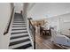 Elegant staircase leading to the upper level, connecting seamlessly with the kitchen and living areas at 1241 White Flint Cir, Durham, NC 27703