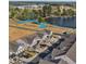 Aerial view of townhomes, highlighting proximity to a lake and walking paths at 125 Paperwhite Pl, Clayton, NC 27527