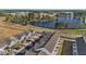 Aerial view of homes near a pond with walking trail at 125 Paperwhite Pl, Clayton, NC 27527