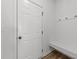 Mudroom with a bench, hooks, and white trim at 125 Paperwhite Pl, Clayton, NC 27527