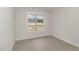 Cozy bedroom with a bright window looking onto an undeveloped lot with distant treetops at 125 Prosecco Dr, Princeton, NC 27569