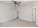 Bedroom with a ceiling fan, neutral paint, plush carpeting, and a connecting bathroom at 125 Prosecco Dr, Princeton, NC 27569
