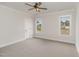 Spacious bedroom features neutral walls, plush carpeting, and natural lighting from two windows at 125 Prosecco Dr, Princeton, NC 27569