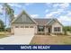Charming single-Gathering home featuring a two-car garage, neutral siding, and manicured landscaping at 125 Prosecco Dr, Princeton, NC 27569