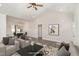 Open-concept living room and dining area with lots of natural light and neutral paint at 125 Prosecco Dr, Princeton, NC 27569