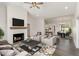 Bright living room with a fireplace, vaulted ceilings, and an open concept design at 125 Prosecco Dr, Princeton, NC 27569