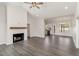 Bright living room with a fireplace, vaulted ceilings, and an open concept design at 125 Prosecco Dr, Princeton, NC 27569
