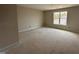 Bedroom featuring a large window and neutral walls at 125 Tuskeegee Dr, Smithfield, NC 27577