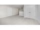Spacious bedroom with neutral carpet, a closet, and access to another room at 125 Tuskeegee Dr, Smithfield, NC 27577