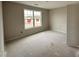 New bedroom with natural light from the window and a view of the front yard at 125 Tuskeegee Dr, Smithfield, NC 27577
