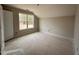 New bedroom with natural light from the window and a view of the back yard at 125 Tuskeegee Dr, Smithfield, NC 27577
