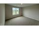 Bedroom showcasing a large window and neutral paint at 125 Tuskeegee Dr, Smithfield, NC 27577