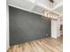 Elegant dining room featuring decorative wall, contemporary chandelier, and luxury vinyl plank flooring at 125 Tuskeegee Dr, Smithfield, NC 27577