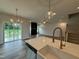 Open concept kitchen featuring white cabinets, stainless steel appliances, and an island at 125 Tuskeegee Dr, Smithfield, NC 27577