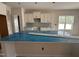 Kitchen with an island, tiled backsplash, and ample storage at 125 Tuskeegee Dr, Smithfield, NC 27577