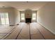 Spacious living room with a fireplace, large windows, and natural light at 125 Tuskeegee Dr, Smithfield, NC 27577