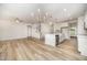 Inviting living space showcasing luxury vinyl plank flooring, a kitchen island, and an open layout at 125 Tuskeegee Dr, Smithfield, NC 27577
