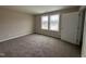 Cozy bedroom featuring large windows and neutral walls, perfect for relaxation and personalization at 131 Wilderness Trl, Smithfield, NC 27577