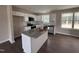 Bright kitchen featuring white cabinets, granite countertops, and stainless steel appliances at 131 Wilderness Trl, Smithfield, NC 27577
