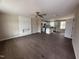 Open-concept living space with hardwood floors and a view of the modern kitchen with island at 131 Wilderness Trl, Smithfield, NC 27577