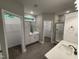 Elegant bathroom with a dual vanity, tiled flooring, a separate shower, and ample storage at 139 Red River Dr, Selma, NC 27576