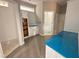 Bathroom with tiled floors, built-in cabinets, and a shower/tub, offering functionality and style at 139 Red River Dr, Selma, NC 27576