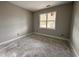 Bedroom with a window providing natural light, ready for new flooring and personal touches at 139 Red River Dr, Selma, NC 27576