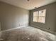 Bedroom with neutral walls, a large window, and clean lines, awaiting new flooring and decor at 139 Red River Dr, Selma, NC 27576