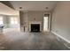 Living room showcasing a fireplace, built-in shelving, and an open floor plan to the kitchen at 139 Red River Dr, Selma, NC 27576