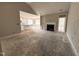 Living room featuring a fireplace, and an open floor plan leading to a kitchen with white cabinets at 139 Red River Dr, Selma, NC 27576