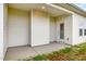 A covered back porch with a concrete floor, offering an outdoor space for relaxing at 141 Trescott St, Smithfield, NC 27577