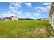 Expansive backyard with lush green grass and a clear view of the home's surroundings at 141 Trescott St, Smithfield, NC 27577