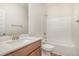 Bathroom with a single vanity, white countertop, and shower-tub combination at 141 Trescott St, Smithfield, NC 27577