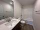 Bathroom featuring a bathtub, toilet, mirror, and vanity at 141 Trescott St, Smithfield, NC 27577