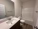 Modern bathroom with a shower, large vanity, and contemporary fixtures, providing a refreshing and stylish space for daily routines at 141 Trescott St, Smithfield, NC 27577