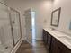 Well-appointed bathroom boasts a shower, dual vanity, and modern finishes, creating a spa-like atmosphere within the home at 141 Trescott St, Smithfield, NC 27577