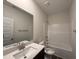Bright bathroom with large mirror and shower-tub combo at 141 Trescott St, Smithfield, NC 27577